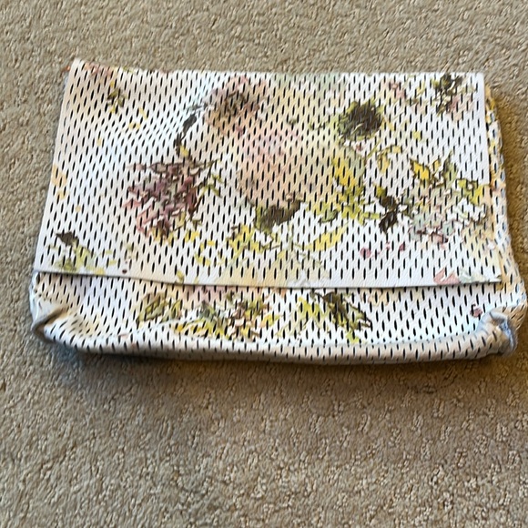 Anthropologie Handbags - Cowhide, leather zippered pouch/purse w flip over zipper top white w tiny slits